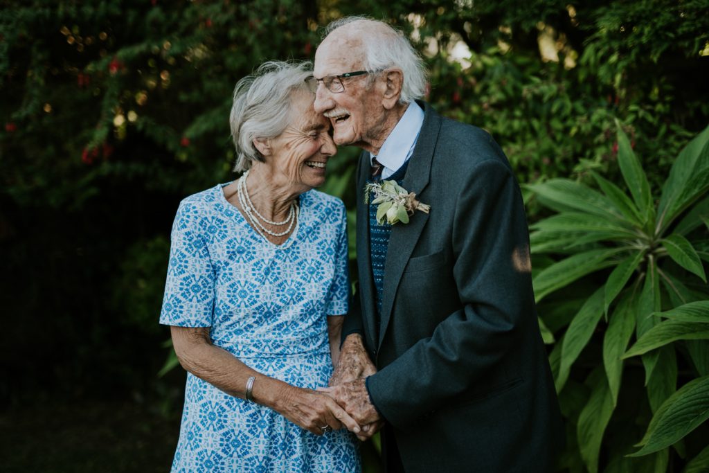 Happy Wedding Couple kiss and laughing on their vow renewal in cornwall