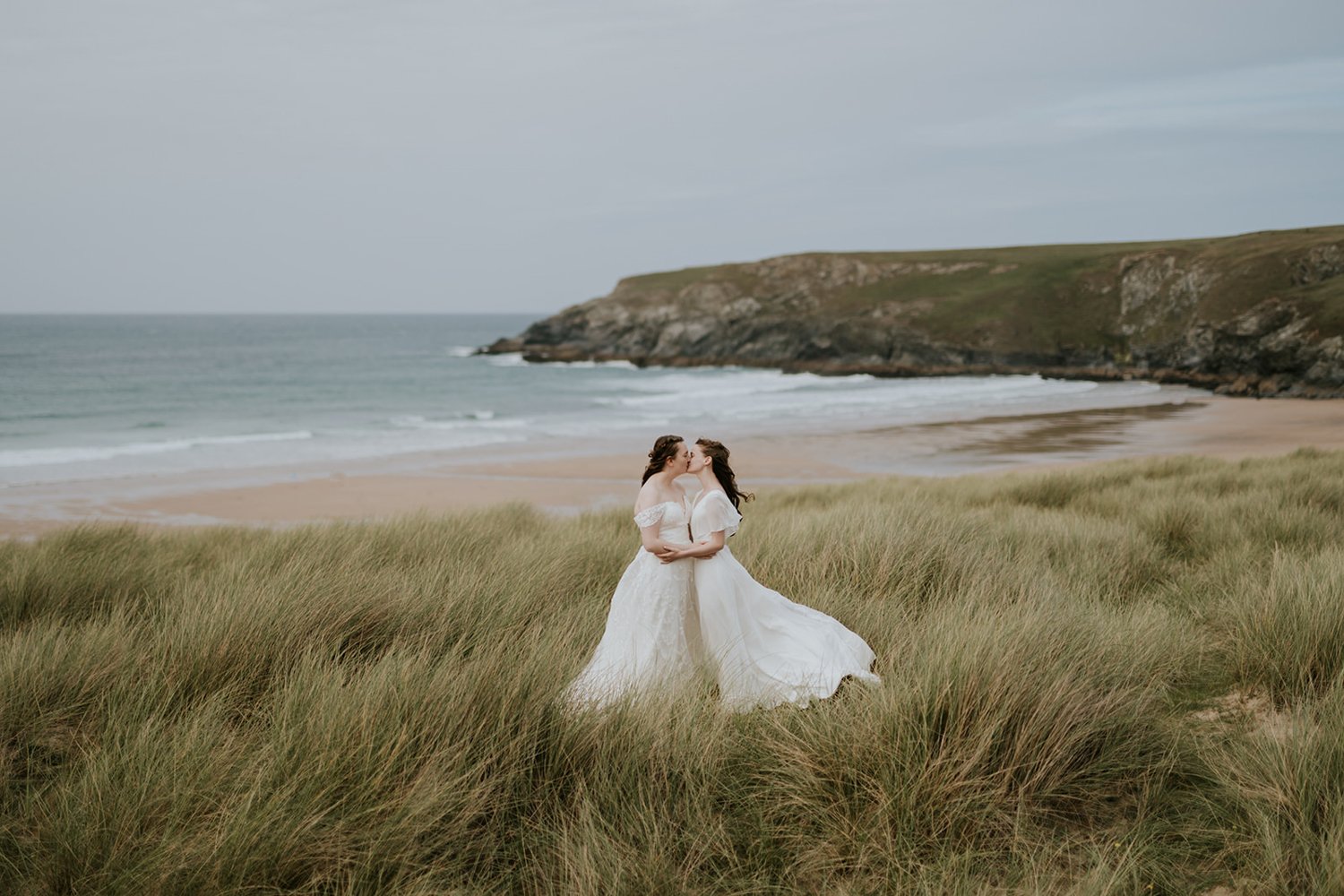 Holywell Bay Beach Elopement Wedding Couple kissing in dunes